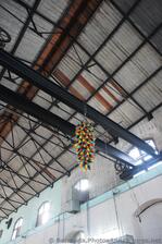 Colorful glass art hanging from beam at Dockyard Glassworks Bermuda.jpg