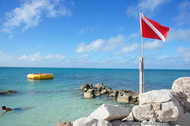Divers Flag Red with Diagnal Stripe at Snorkel Park Beach.jpg