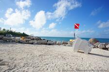 Stacked Beach Chairs Flag & Sand at Snorkel Park Beach.jpg