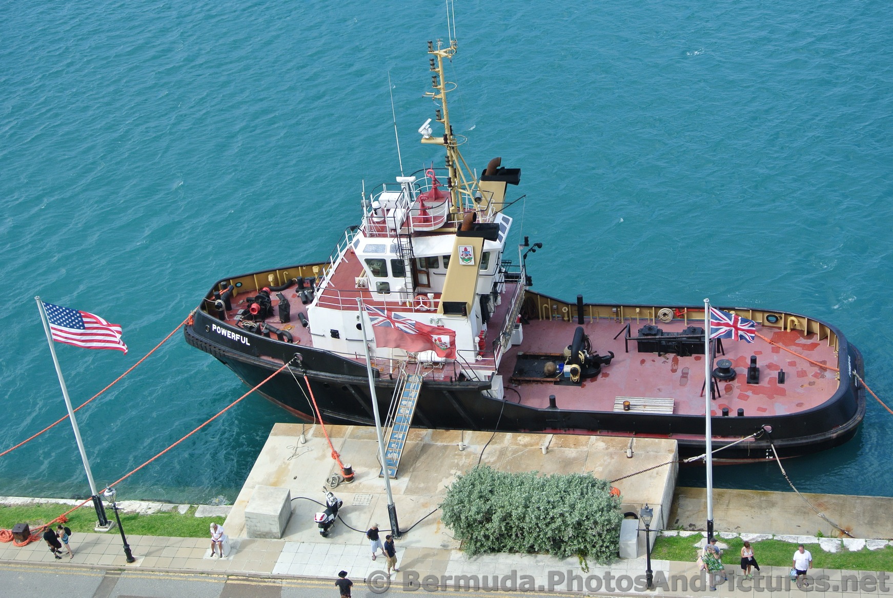 Tug Boat named Powerful docked near cruise ship in Bermuda.jpg