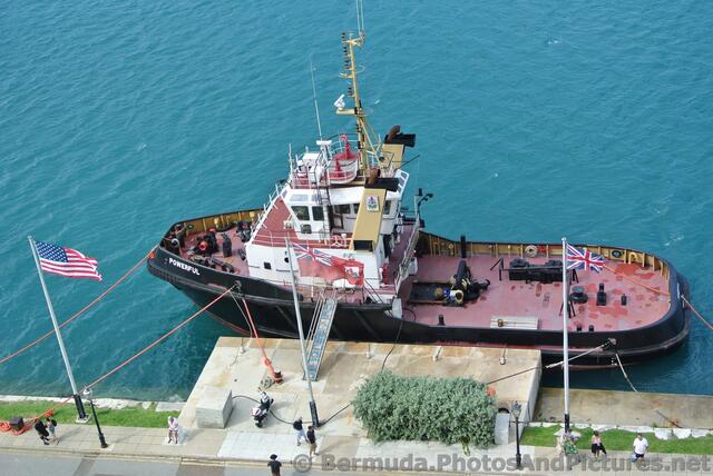 Tug Boat named Powerful docked near cruise ship in Bermuda.jpg