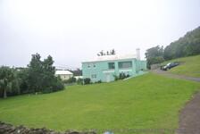Light Blue Two Story Home in Bermuda on Middle Road.jpg