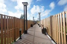Fenced walkway towards Miniature Golf & Snorkel Park Beach Bermuda.jpg