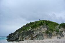 Person on top of Rocky Hill at Horseshoe Bay Beach.jpg