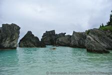 Rocky formations surround the Horseshoe Bay Cove.jpg