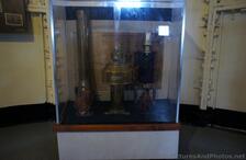 Oil cans & valves + tubes in a display case at Gibbs Hill Lighthouse.jpg