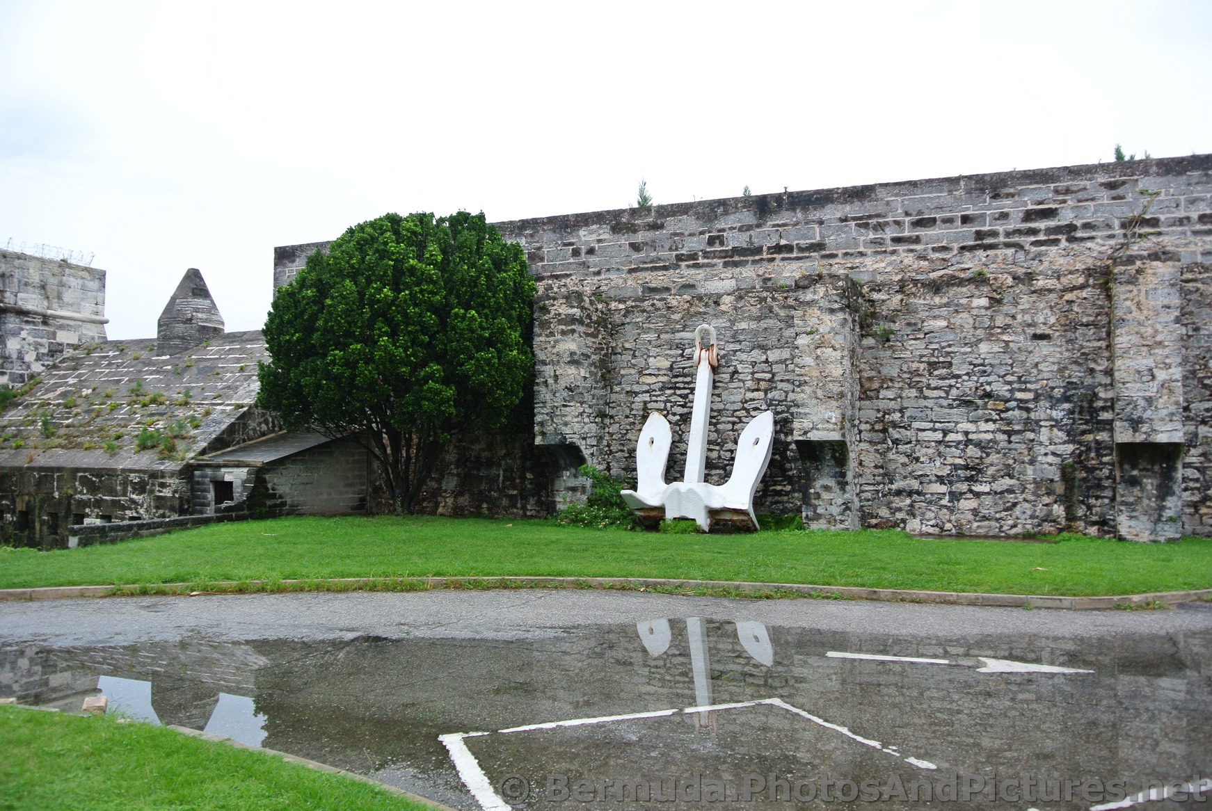 Anchor lays against wall of Royal Naval Dockyard Bermuda.jpg
