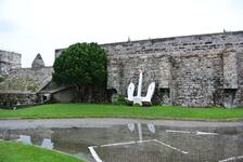 Anchor lays against wall of Royal Naval Dockyard Bermuda.jpg