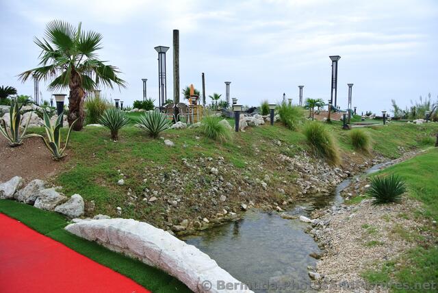 Small stream runs under bridge at Bermuda Fun Golf.jpg