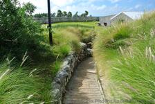 Narrow walkway sloping downwards at grounds of Commsioner's House Bermuda Maritime Museum.jpg