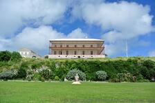 Commissioner's House perched atop of HIll at Royal Dockyward King's Wharf Bermuda.jpg