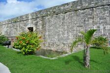 Moat & red flowers outside entrance to Bermuda Maritime Museum.jpg