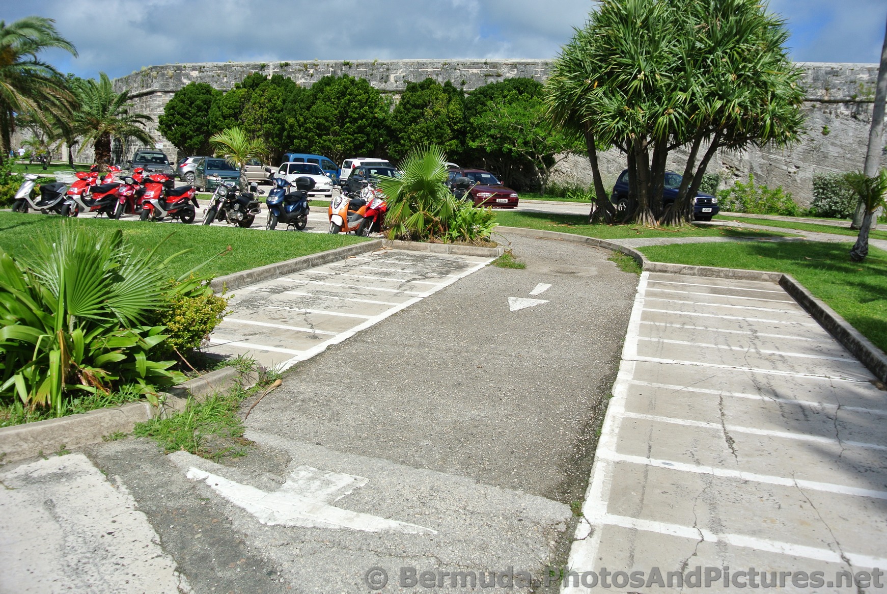 Motorcycles in parking lot of Bermuda Royal Naval Dockyard.jpg